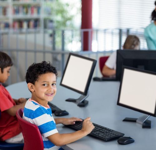 boy-with-classmates-teacher-computer-class (1)